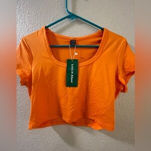 bright orange crop top
